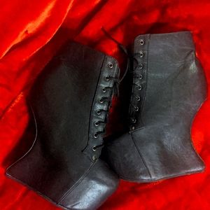 Black leather heelless boots